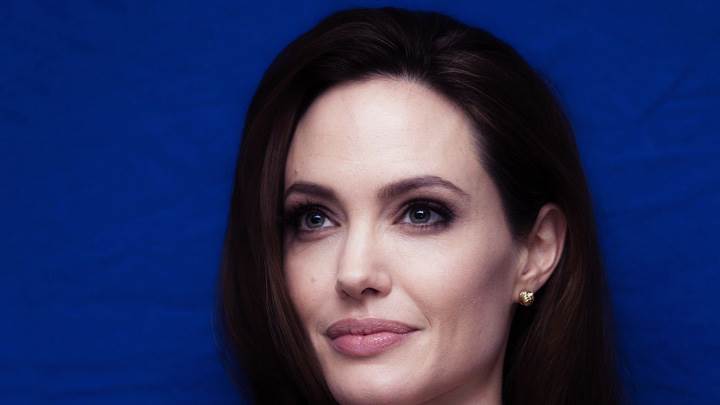 Angelina Jolie Sweet Smiling Face Closeup On Blue Background